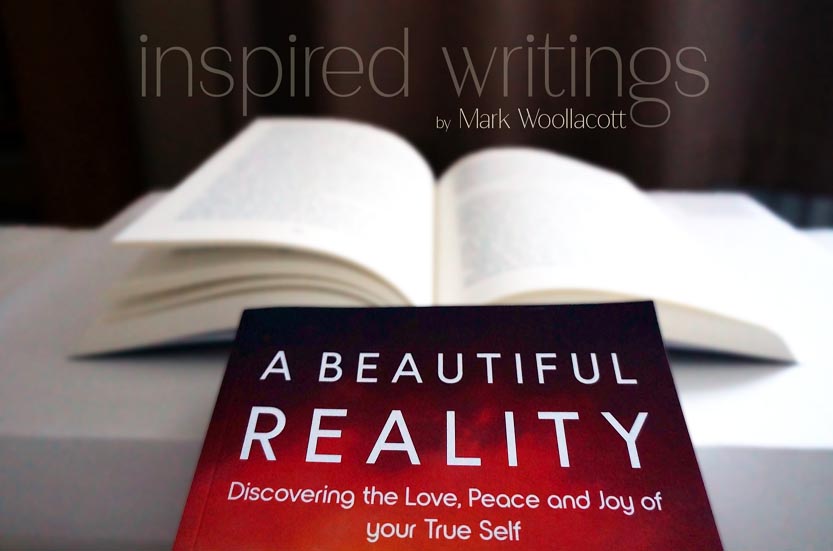 Book cover and open pages of A Beautiful Reality book by mystical author Mark Woollacott