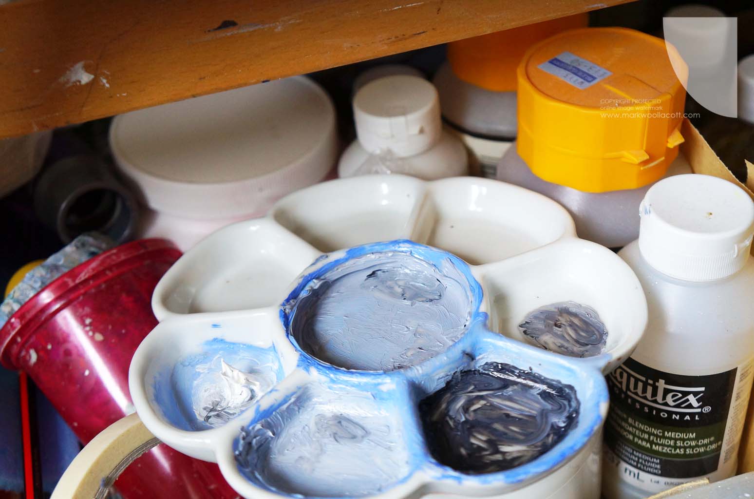 oil paints in a mixing palette used on a boat painting